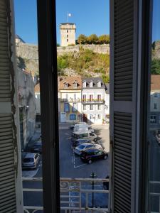 a view from a window of a parking lot at 18 rue des petits fossés - 5 in Lourdes