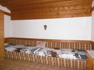 Postel nebo postele na pokoji v ubytování Ferienhaus Anderles-Alm