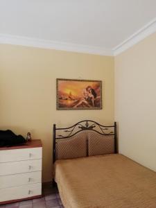 Кровать или кровати в номере Apartamienty Gorkogho 38