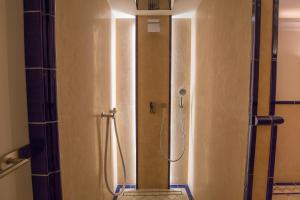 a shower stall in a bathroom with a shower at Windeby 6D in Wenningstedt +19 photos