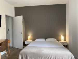 Postel nebo postele na pokoji v ubytování Brit Hôtel Confort Cléria Lorient Centre
