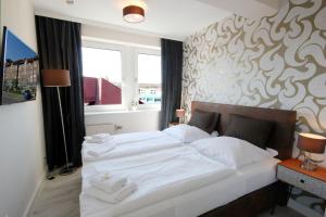 Ein Bett oder Betten in einem Zimmer der Unterkunft Haus Anna by Rujana