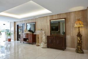 a large room with a desk and a mirror at Zoukotel Hotel in Jounieh +37 photos