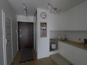 Kuchyň nebo kuchyňský kout v ubytování Apartament Zamojska - GarwoNocka