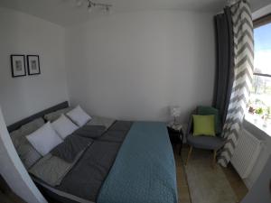 Postel nebo postele na pokoji v ubytování Apartament Zamojska - GarwoNocka