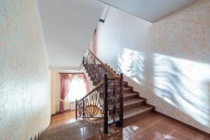 a staircase in a house with a stair railing at Old City in Pskov