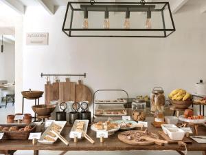 a table with many different types of food on it at Finca Serena Mallorca, Small Luxury Hotels in Montuiri