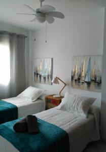 En eller flere senge i et værelse på Apartamento la albariza.