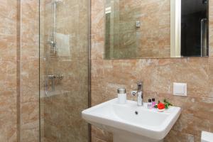 Koupelna v ubytování Boutique Hotel