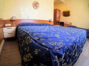Letto o letti in una camera di Albergo Dei Leoni