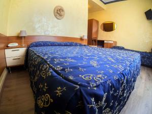 Letto o letti in una camera di Albergo Dei Leoni