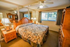a bedroom with a large bed and a window at Coral Reef Resort in St Pete Beach +16 photos