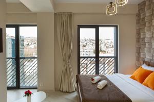 Postel nebo postele na pokoji v ubytování Boutique Hotel