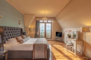 A bed or beds in a room at The Brehon Hotel & Spa