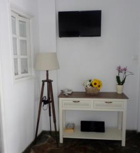 TV a/nebo společenská místnost v ubytování Langas Villas