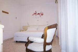 เตียงในห้องที่ Hotel Arcobaleno