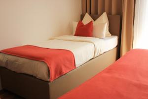 Postel nebo postele na pokoji v ubytování Hotel Alpenland
