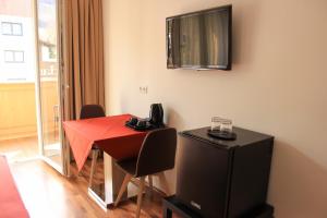 TV a/nebo společenská místnost v ubytování Hotel Alpenland