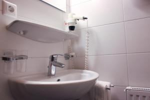 Koupelna v ubytování Hotel Alpenland