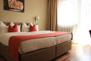 Postel nebo postele na pokoji v ubytování Hotel Alpenland