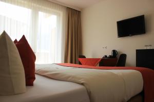 Postel nebo postele na pokoji v ubytování Hotel Alpenland + 37 fotografií