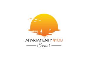 a silhouette of a bear with the sun in the background at Apartamenty4you - Apartamenty Atlantic in Sopot