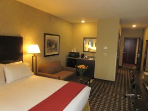 a hotel room with two beds and a television at Holiday Inn Express & Suites Butler, an IHG Hotel in Butler