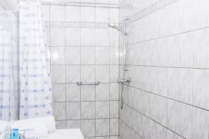 a bathroom with a shower and a sink at Camping village SY in Ferrières