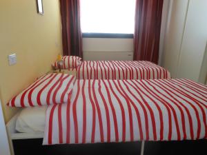 Łóżko lub łóżka w pokoju w obiekcie B&B Relax