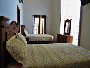 Postel nebo postele na pokoji v ubytování Hotel Purisima Concepción
