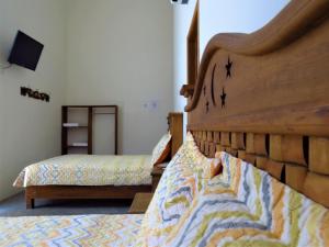 Postel nebo postele na pokoji v ubytování Hotel Purisima Concepción