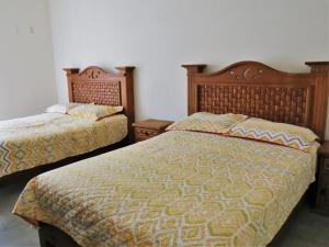 Postel nebo postele na pokoji v ubytování Hotel Purisima Concepción