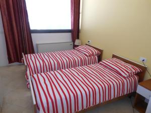 Łóżko lub łóżka w pokoju w obiekcie B&B Relax