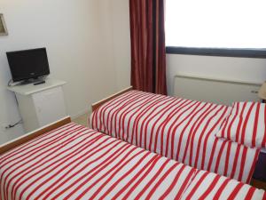 Łóżko lub łóżka w pokoju w obiekcie B&B Relax