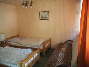 Postel nebo postele na pokoji v ubytování Camping Anastazja