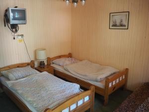 Postel nebo postele na pokoji v ubytování Camping Anastazja