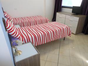 Łóżko lub łóżka w pokoju w obiekcie B&B Relax