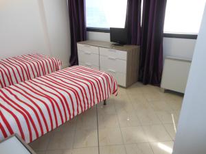 Łóżko lub łóżka w pokoju w obiekcie B&B Relax