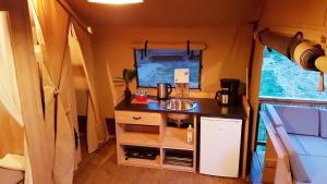 a kitchen with a sink in a tiny house at Analaya in Vias