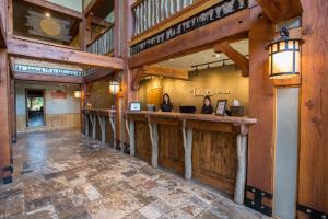 a restaurant with a bar in a building with wooden walls at Lodges at Deer Valley in Park City