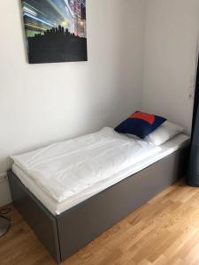 a bed in a bedroom with a picture on the wall at My room serviced apartment-Messe in Munich