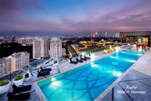 a large swimming pool on the roof of a building at SKY POOL Designer Suite 2-7Pax at KL City in Kuala Lumpur