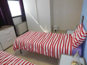 Łóżko lub łóżka w pokoju w obiekcie B&B Relax