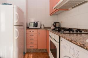a kitchen with a stove and a microwave at Big Flat at center of Valencia. WIFI in Valencia