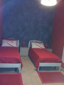 Postel nebo postele na pokoji v ubytování B&B LAVIKA PEDARA