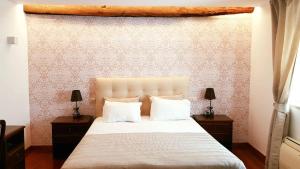 Ein Bett oder Betten in einem Zimmer der Unterkunft Quinta Vale do Homem