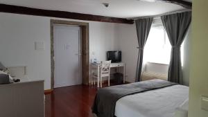 Ein Bett oder Betten in einem Zimmer der Unterkunft Quinta Vale do Homem