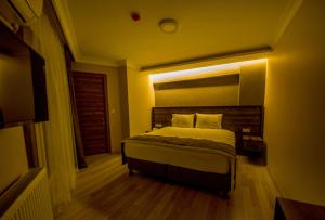 Postel nebo postele na pokoji v ubytování Fidanoglu Suite Hotel