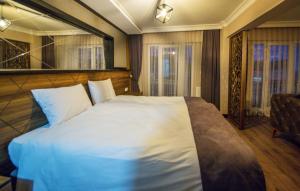 Postel nebo postele na pokoji v ubytování Fidanoglu Suite Hotel