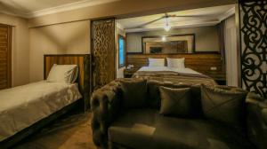 Giường trong phòng chung tại Fidanoglu Suite Hotel